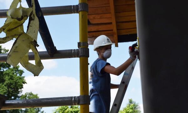 Natalie Smith, a volunteer who is a freshman at the University of South Carolina, works on a Habitat for Humanity project in Redzynskie, a small Polish village of about 1,400 people. Smith, one of 14 volunteers, would leave Poland filled with gratitude. “You don’t realize what we have,” she said. “We take a toilet and running water for granted.” CONTRIBUTED BY MOLLY SMITH