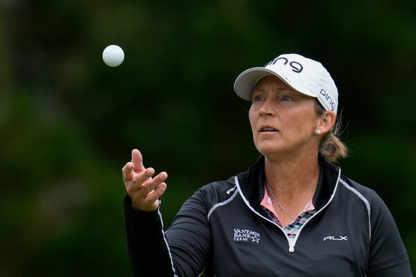 FILE -Angela Stanford tosses her golf ball in the air during a practice round for the U.S. Women's Open golf tournament at Pebble Beach Golf Links, Wednesday, July 5, 2023, in Pebble Beach, Calif. (AP Photo/Godofredo A. Vásquez, File)