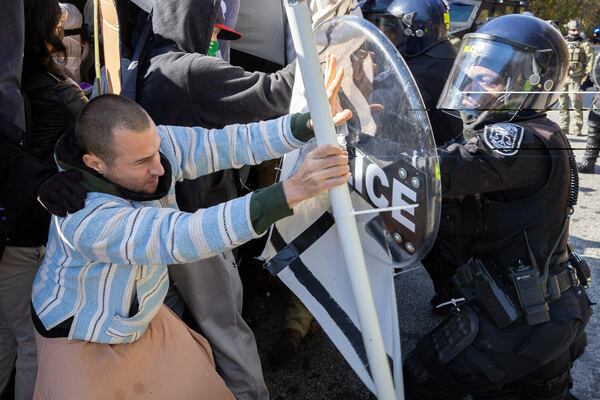 Protestors demonstrating against Atlanta’s public training safety center clash with police in Atlanta on Monday, November 13, 2023. (Arvin Temkar / arvin.temkar@ajc.com)