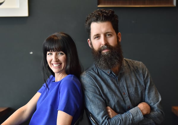 December 21, 2018 Hapeville - Husband and wife artists Whitney and Micah Stansell at Drip Coffee Shop near a pedestrian bridge they will transform in downtown Hapeville. HYOSUB SHIN / HSHIN@AJC.COM