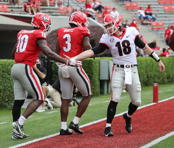 Georgia wide receiver Kearis Jackson gets five from quarterback JT Daniels in the endzone after they connected for a touchdown reception during the third quarter of the G-Day Game at Sanford Stadium on Saturday, April 17, 2021, in Athens. The Red Team beat the Black Team 28-23.     “Curtis Compton / Curtis.Compton@ajc.com”