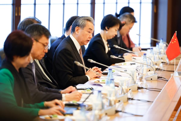 Chinese Foreign Minister Wang Yi, center, speaks during their trilateral foreign ministers’ meeting with Japan and South Korea in Tokyo Saturday, March 22, 2025.(Rodrigo Reyes Marin/Pool Photo via AP)