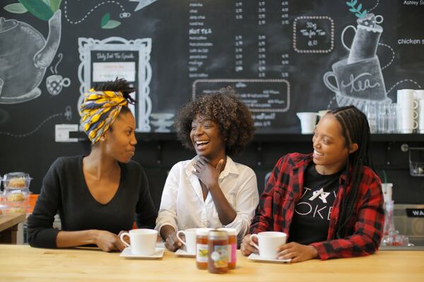 Ife Madzimoyo (from left), Bonsuk Awani and Jaz Stewart staff the counter at Just Add Honey at the Sweet Auburn Curb Market. BOB ANDRES /BANDRES@AJC.COM