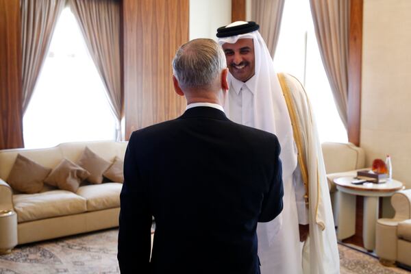 Qatar's Emir Sheikh Tamim Bin Hamad Al-Thani welcomes U.S. Defense Secretary James Mattis (C) at his residence, the Sea Palace on April 22, 2017 in Doha, Qatar.