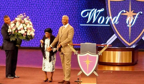 Rev. Emma Rowland with Bishop Dale Bronner when she was honored with 100 flowers at Word of Faith church in Austell where she preaches and teaches. Photo courtesy of Rowland's granddaughter Cheryl Pope Clark.