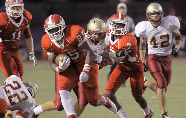 Former Milton running back Peyton Barber (25) joins the Tampa Bay Buccaneers. (Akili-Casundria Ramsess / Special to AJC)