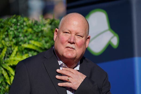 FILE - Former Seattle Seahawks coach Mike Holmgren speaks after being introduced as the newest member of the team's Ring of Honor during halftime in an NFL football game, Sunday, Oct. 31, 2021, in Seattle. (AP Photo/Ted S. Warren, File)