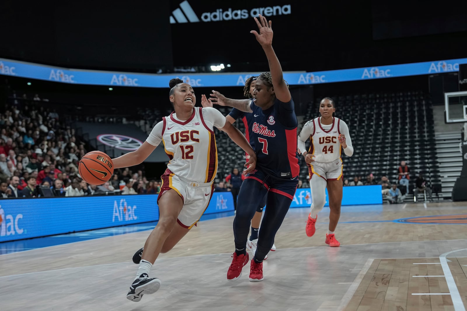 USC Trojans's guard Juju Watkins, right, competes for the ball against Ole Miss's forward Starr Jacobs, left, during the basketball match between the University of Southern California (USC) and Ole Miss, Monday, Nov. 4, 2024 in Paris, France. (AP Photo/Aurelien Morissard)