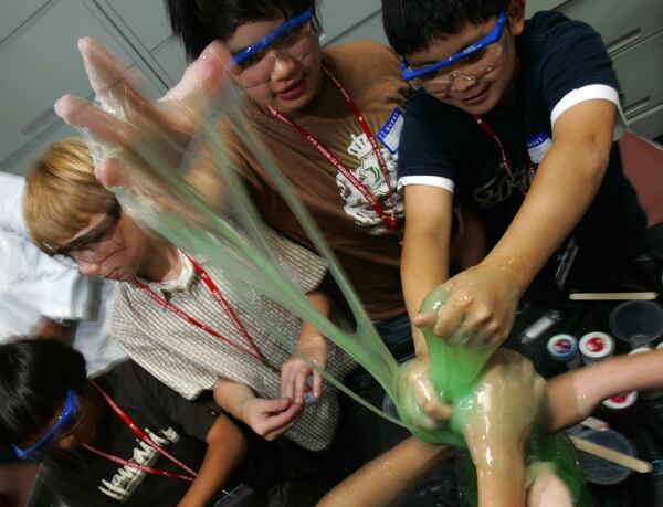 Children create their own slime during this file photo of Mattel's Take Our Children To Work Day workshop in El Segundo, Calif., 