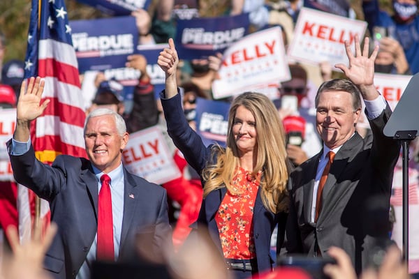 11/20/2020 �  Canton, Georgia �Vice President Mike Pence (left), Senator Kelly Loeffler (center) and Senator David Perdue (right) wave at the crowd gathered during a Defend the Majority Republican Rally in Canton, Ga., Friday, November 20, 2020.  (Alyssa Pointer / Alyssa.Pointer@ajc.com)