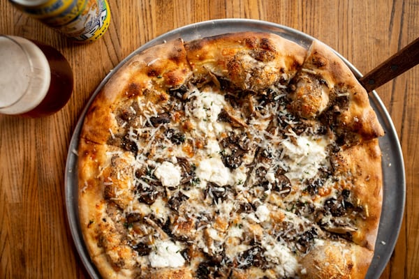 Funghi Pizza with ricotta, roasted mushrooms, pecorino, and crispy thyme. Photo credit- Mia Yakel