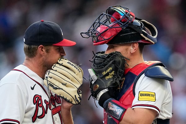 Atlanta Braves starting pitcher Bryce Elder, left, talks with catcher Sean Murphy during the third inning of the team's baseball game against the Minnesota Twins on Tuesday, June 27, 2023, in Atlanta. (AP Photo/John Bazemore)