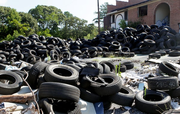 Georgians pay a $1 fee for each replacement tire they buy. When the fee was created, it was proposed as a way to fund the cleanup of tire dumps like this one in Atlanta. But the money has often been diverted to the state's general fund to pay for things such as schools, public health care and local projects. PHIL SKINNER