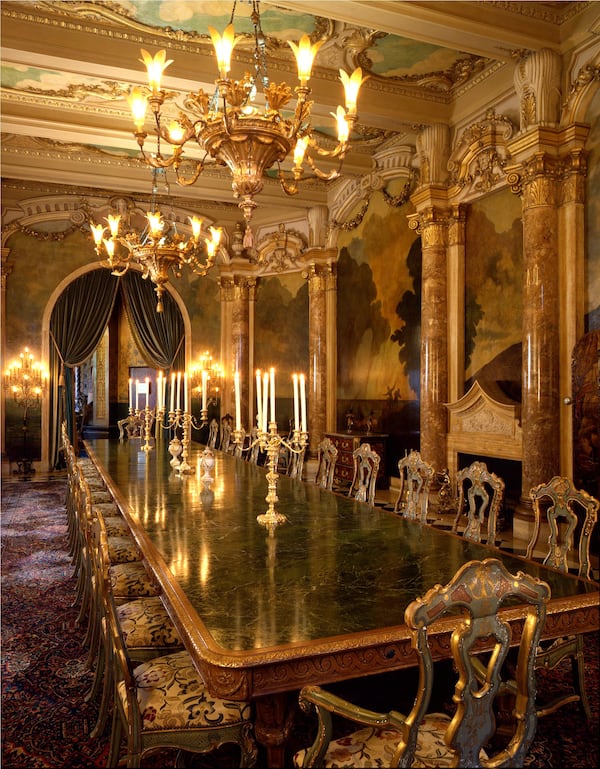 Mar-a-Lago’s dining room was photogrpahed in 1993 with Marjorie Merriweather Post’s original furniture, including her marble-topped dining table, which could seat 34 dinner guests. The room’s molding and murals are adaptations of the Chigi Palace in Rome. Post kept a notebook with photos of her nearly 30 china patterns, crystal and silverware. Some of the pieces were still in use in 1995, when Donald Trump opened the Mar-a-Lago Club. Photo / C.J. Walker