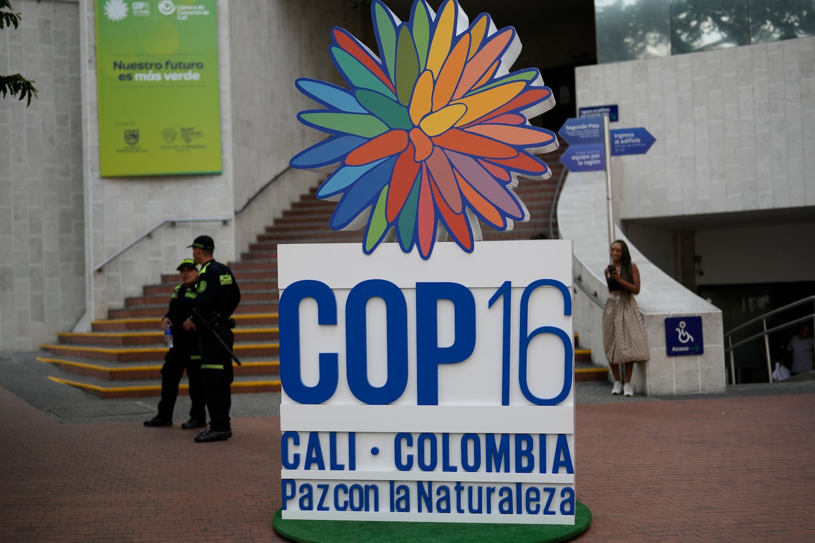 FILE - Police stand guard in front a hotel at COP16, the United Nations Biodiversity Conference, in Cali, Colombia, Saturday, Oct. 19, 2024. (AP Photo/Fernando Vergara, File)