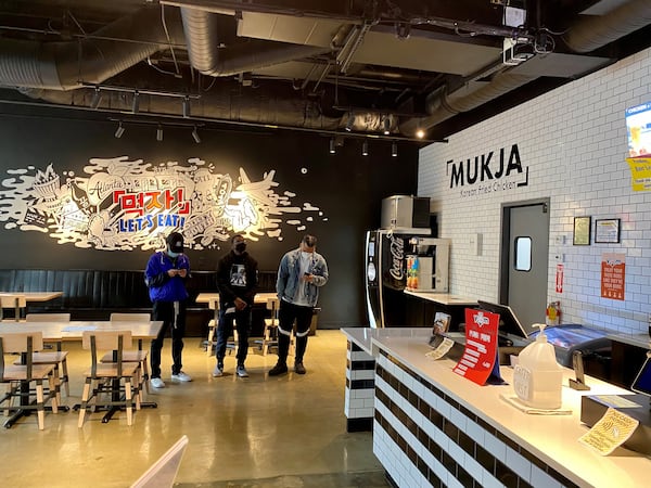 Customers wait for orders at Mukja Korean Fried Chicken. Wendell Brock for The Atlanta Journal-Constitution