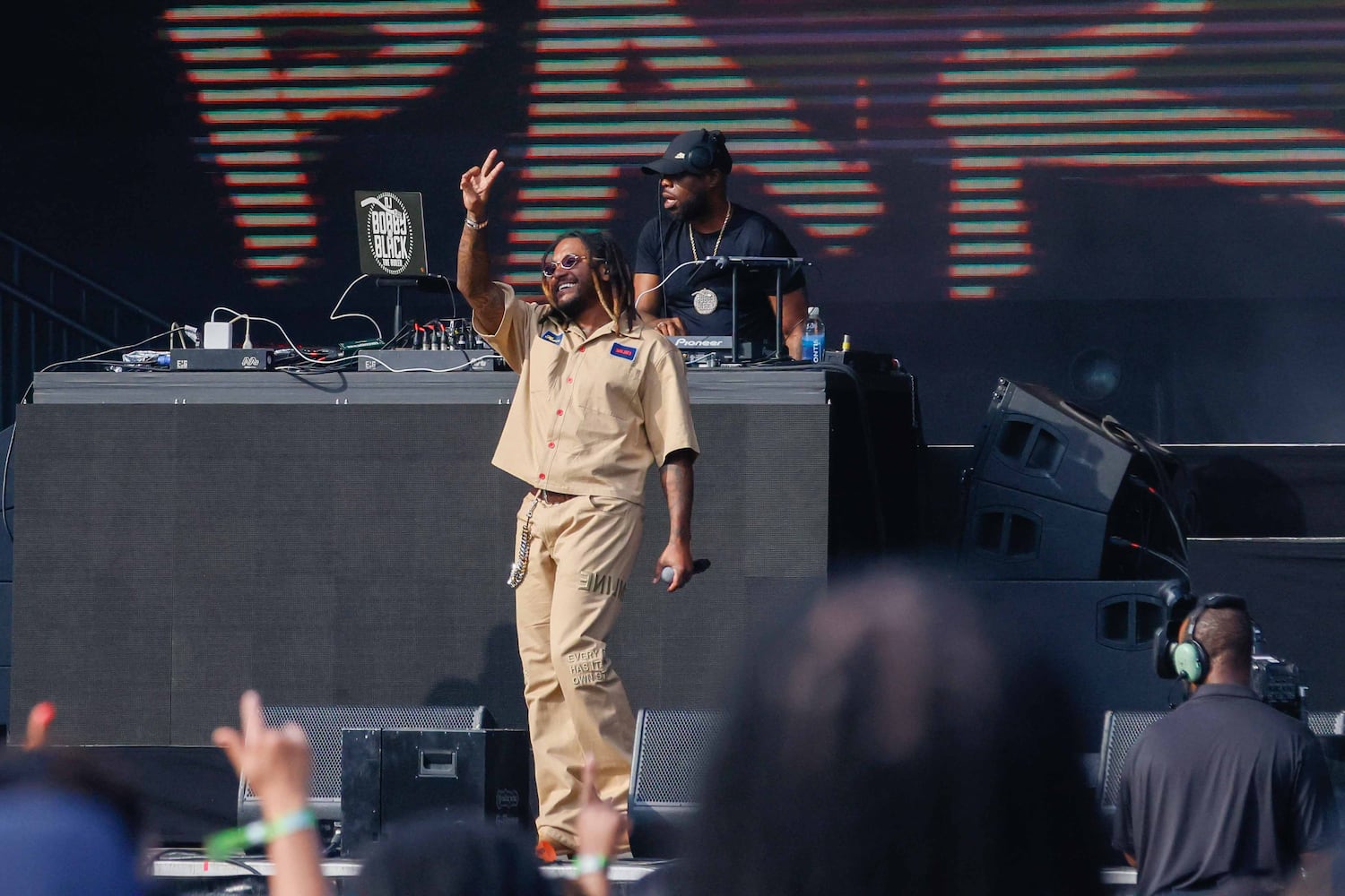 Elmiene signals to the crow as he finishes his performance on the P&G stage during the ONe Music Fest on Sunday, October 27, 2024, at Central Park. 
(Miguel Martinez / AJC)