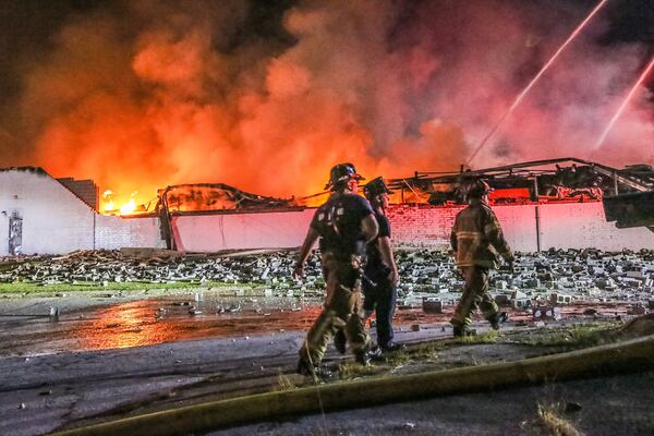 The blaze caused the roof to collapse. JOHN SPINK / JSPINK@AJC.COM