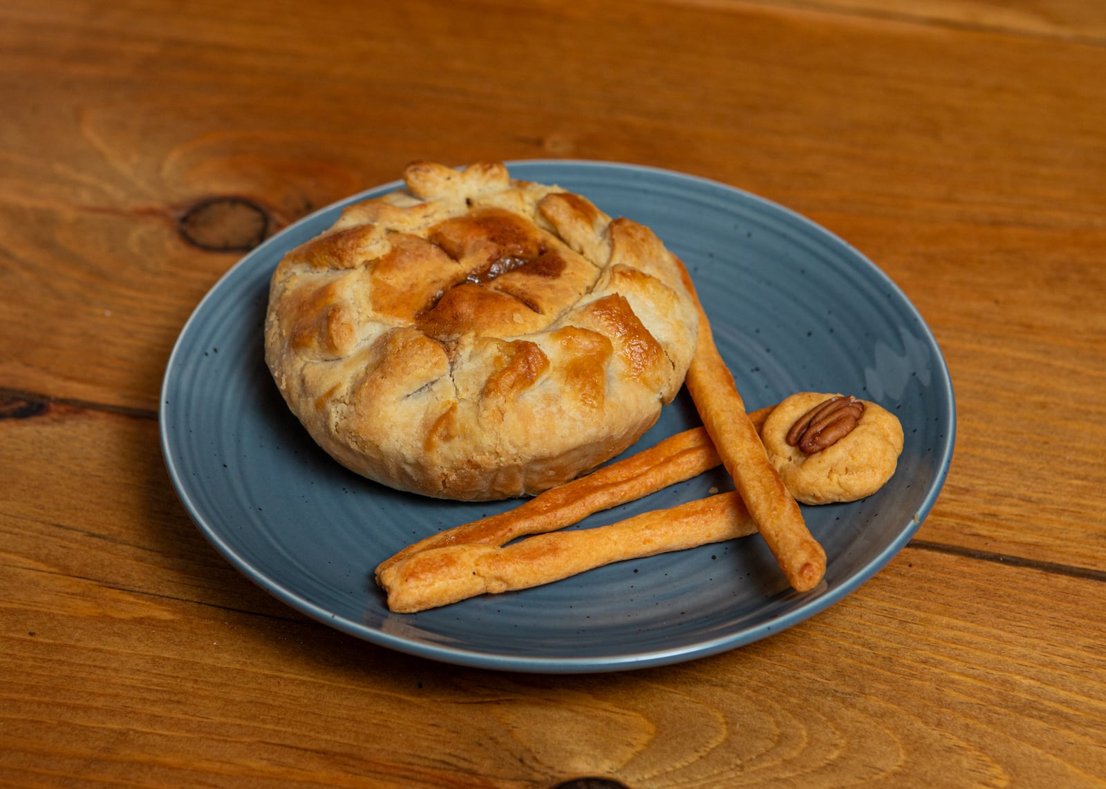 Mini apple pie with cheese straw crust, cheese straws and rounds, baked by chef Tenney Flynn. Cheese straws are a timeless component of Southern cuisine. (Aaliyah Man for The Atlanta Journal-Constitution)