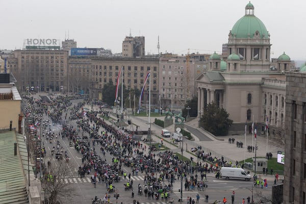 Hundreds of bikers gather in front of the Serbian parliament during a major anti-corruption rally led by university students in Belgrade, Serbia, Saturday, March 15, 2025. (AP Photo/Marko Drobnjakovic)