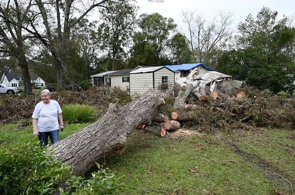 Linda Hall shows damages caused by Hurricane Helene at her daughter’s home, Tuesday, Oct. 1, 2024, in Alapaha. (Hyosub Shin / AJC)