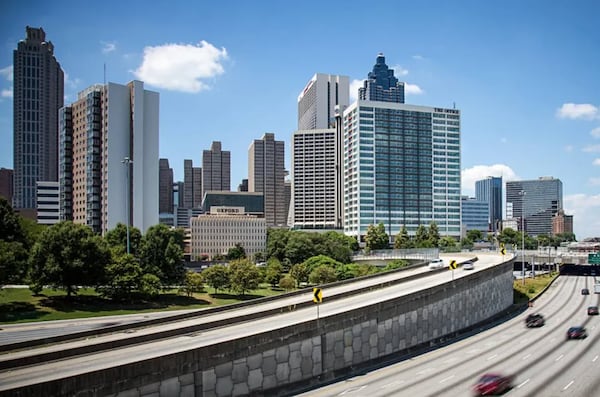 The Altitude Apartments, formerly known as The Office apartments, is shown to the right among the downtown Atlanta skyline.