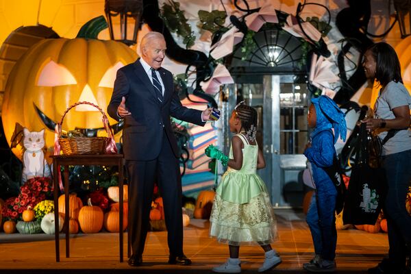 President Joe Biden hosts local area students, military-connected children, and neighborhood families for trick-or-treating, ahead of Halloween on Thursday, at the South Lawn of the White House in Washington Wednesday, Oct. 30, 2024. (AP Photo/Ben Curtis)