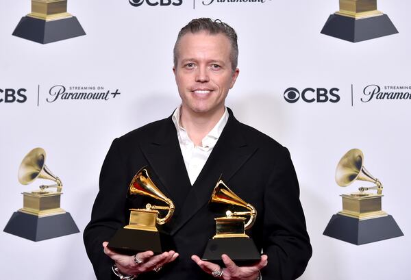 Jason Isbell poses in the press room with the awards for best american roots song for "Cast Iron Skillet" and best americana album for "Weathervanes" during the 66th annual Grammy Awards on Sunday, Feb. 4, 2024, in Los Angeles. (Photo by Richard Shotwell/Invision/AP)