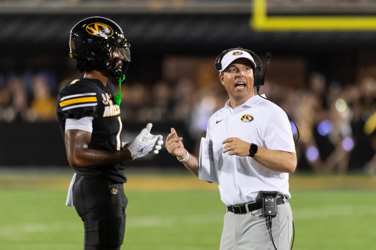 Missouri head coach Eliah Drinkwitz, right, talks with wide receiver Theo Wease Jr., during a timeout in the second quarter of an NCAA college football game against Murray State, Thursday, Aug. 29, 2024, in Columbia, Mo. (AP Photo/L.G. Patterson)