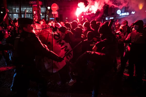 Protestors and police clash during a rally against the "Israel is Forever" gala organized by far-right Franco-Israeli figures, in Paris, Wednesday, Nov. 13, 2024, on the eve of the UEFA Nations League 2025 soccer match between France and Israel. (AP Photo/Louise Delmotte)