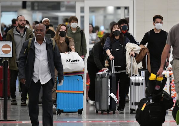 International travelers arrive at Hartsfield-Jackson on Tuesday, March 3, 2020.(Hyosub Shin / Hyosub.Shin@ajc.com)