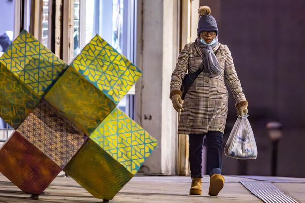 Cassandra Hines walks in the cold to MARTA's Five Points station in downtown Atlanta.