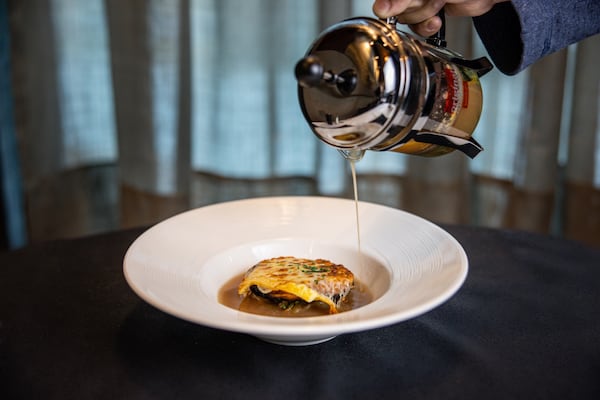 The consommé a l'oignon Français is poured tableside at Resto L'Antoinette in Milton. (Courtesy of Resto L'Antoinette)