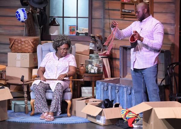 Sharpe’s character Marcus looks through old clothes belonging to his grandmother, played by Andrene Ward-Hammond, to prepare his costume for Dragon Con in a rehearsal for “Black Nerd.” Jenna Eason / Jenna.Eason@coxinc.com