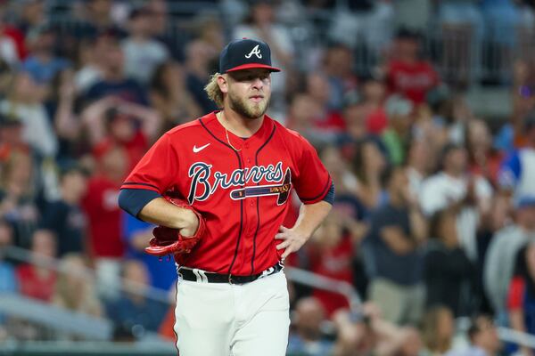 Atlanta Braves relief pitcher A.J. Minter reacts after giving up the go-ahead two-run home run to Houston Astros designated hitter Yordan Alvarez (not pictured) during the ninth inning at Truist Park, Friday, April 21, 2023, in Atlanta. The Braves lost to the Astros 6-4. Jason Getz / Jason.Getz@ajc.com)
