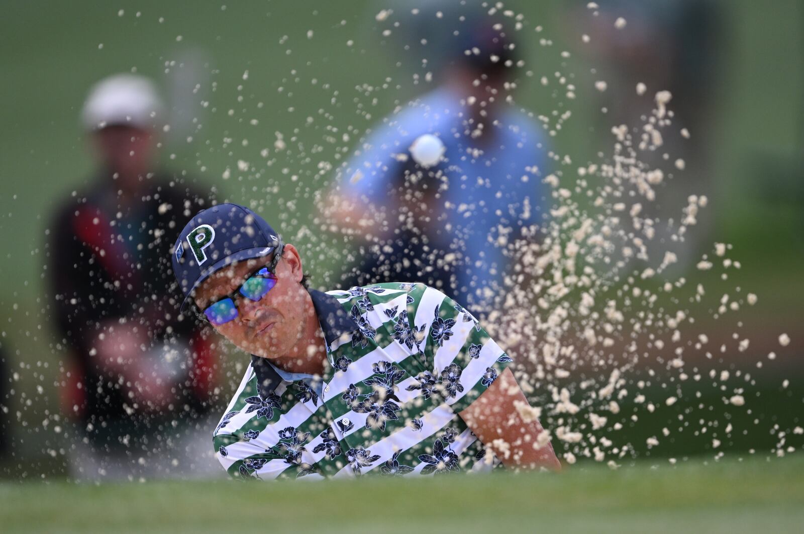 Rickie Fowler hits from bunker on seventh holeat the 2024 Masters Tournament at Augusta National Golf Club, Thursday, April 11, 2024, in Augusta, Ga. (Hyosub Shin / Hyosub.Shin@ajc.com)
