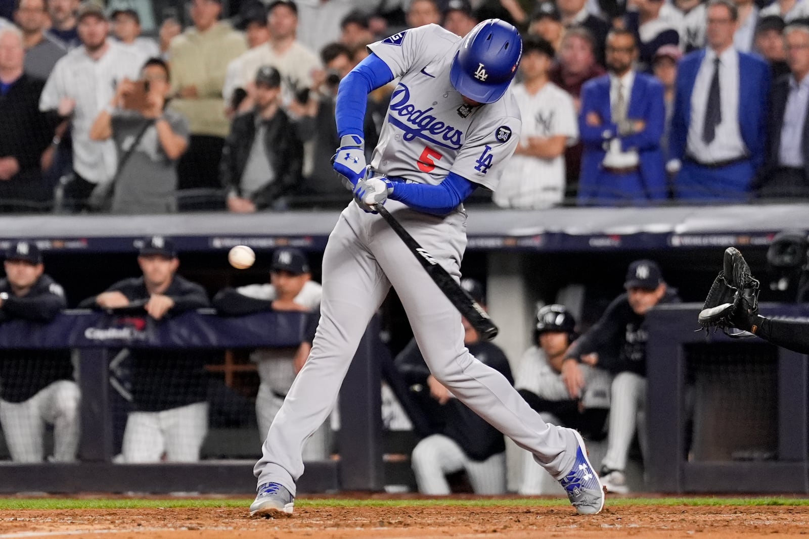 Los Angeles Dodgers' Freddie Freeman hits two RBI single during the fifth inning in Game 5 of the baseball World Series against the New York Yankees, Wednesday, Oct. 30, 2024, in New York. (AP Photo/Ashley Landis)