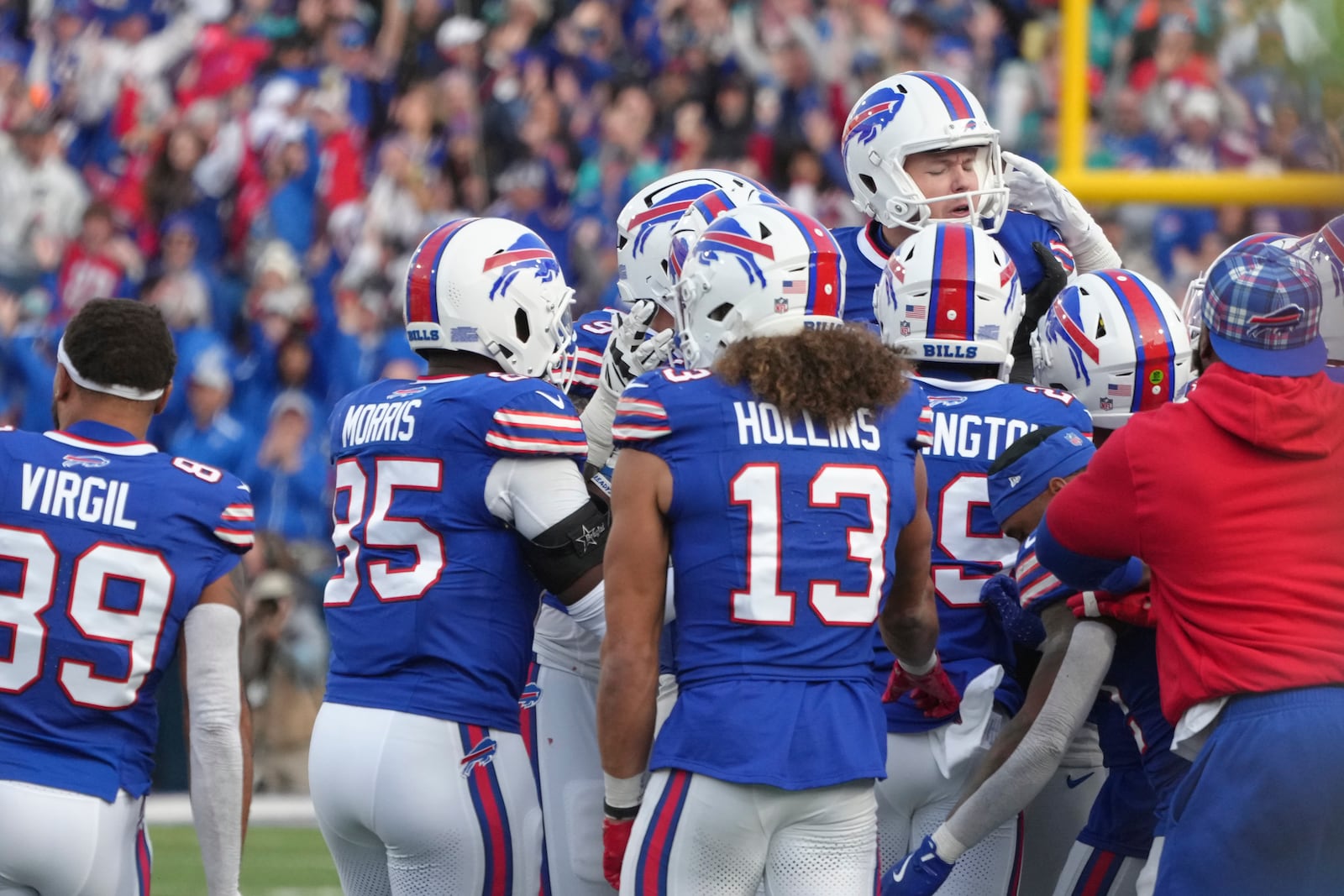 Buffalo Bills place kicker Tyler Bass, top, right, celebrates with his teammates after kicking the game winning field goal during the second half of an NFL football game against the Miami Dolphins Sunday, Nov. 3, 2024, in Orchard Park, N.Y. (AP Photo/Gene Puskar)