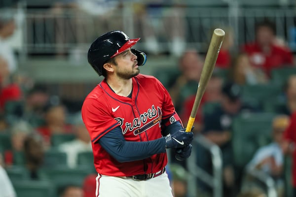 Atlanta Braves catcher Travis d'Arnaud hits a home run during the fifth inning against the Texas Rangers at Truist Park, Friday, April 19, 2024, in Atlanta. This was the second of three home runs hit by d'Arnaud. (Jason Getz / AJC)
