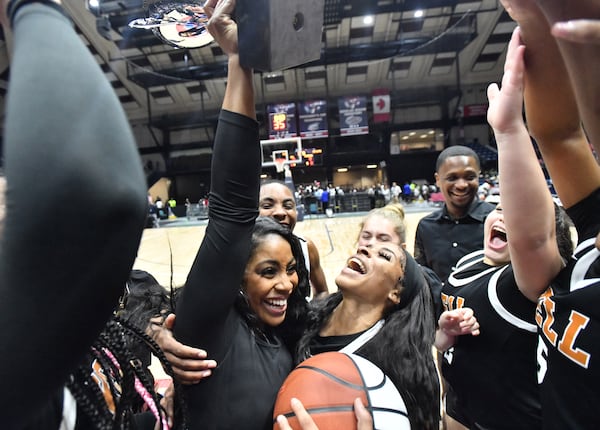 Kell’s head coach Kendra Bailey (center left) and Crystal Henderson (center right) celebrate their victory over Warner Robins during 2023 GHSA Basketball Class 5A Girl’s State Championship game at the Macon Centreplex, Thursday, March 9, 2023, in Macon, GA. Kell won 57-36 over Warner Robins. (Hyosub Shin / Hyosub.Shin@ajc.com)