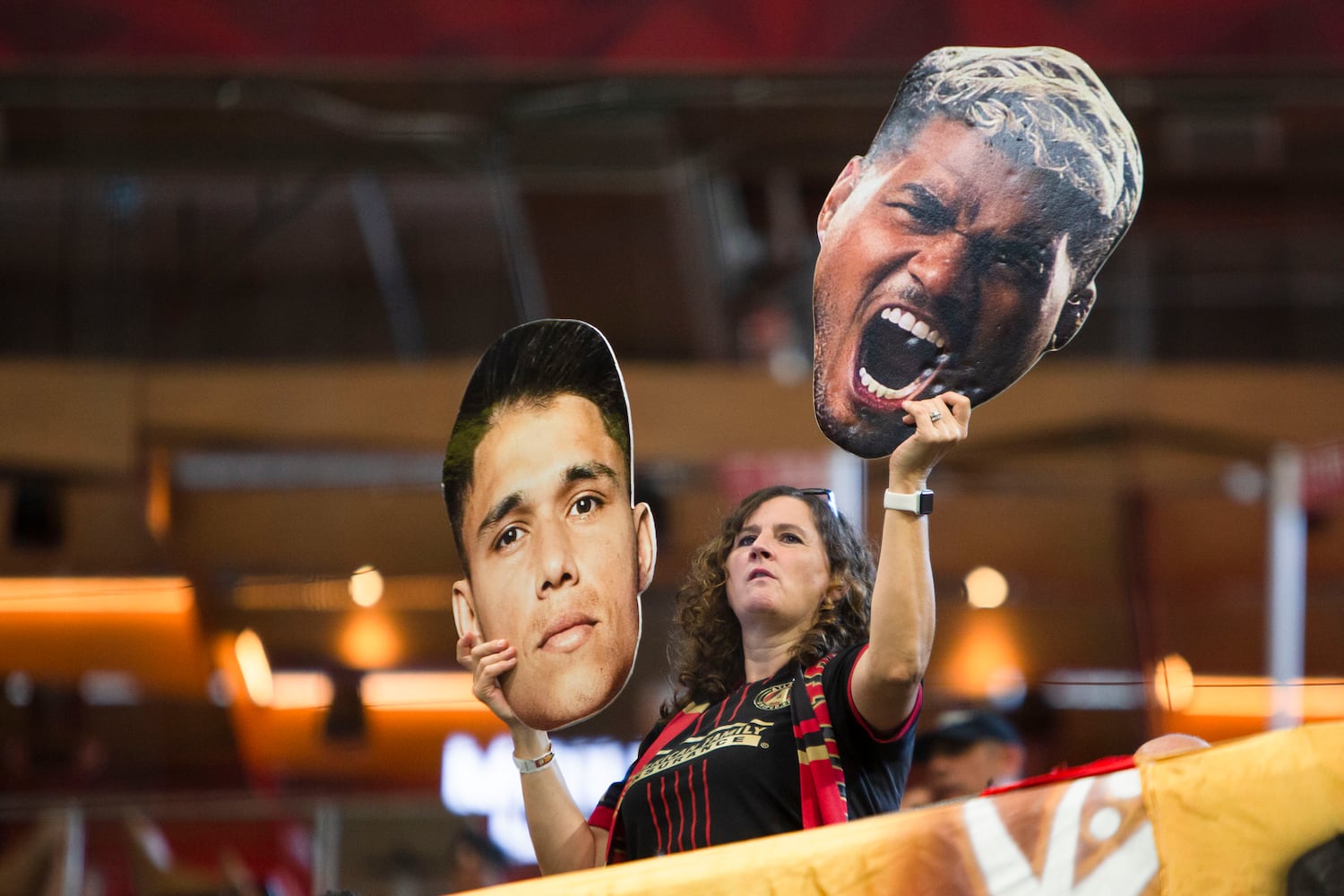 An Atlanta United fan holds up fatheads of Atlanta United players. CHRISTINA MATACOTTA FOR THE ATLANTA JOURNAL-CONSTITUTION.