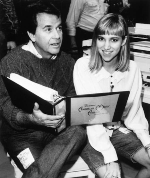 Clark and former teen singing star Debbie Gibson go over the script for the 16th annual telecast of the "American Music Awards" during rehearsals at Los Angeles' Shrine Auditorium Friday night, January 28, 1989.