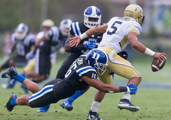 Duke's Jeremy Cash tackles Georgia Tech's Justin Thomas for a loss during the first half of an NCAA college football game, in Durham, N.C., Saturday, Sept. 26, 2015. (AP Photo/Rob Brown)