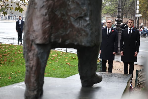 French President Emmanuel Macron, right, and British Prime Minister Keir Starmer attend ceremony in front of the statue of Winston Churchill near the Champs Elysees avenue, during commemorations marking the 106th anniversary of the WWI Armistice, in Paris, France, Monday, Nov.11 2024. (Christophe Petit Tesson, Pool via AP)