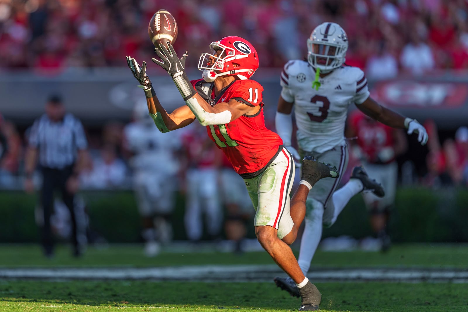 Georgia wide receiver Arian Smith (11) catches the ball during an NCAA college football game against Mississippi State, Saturday, Oct. 12, 2024, in Athens, Ga. (AP Photo/Jason Allen)