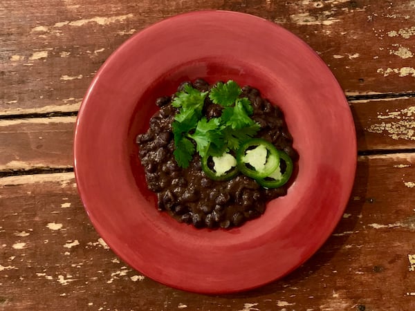 Warmly Spiced Black Beans. John Kessler for The AJC