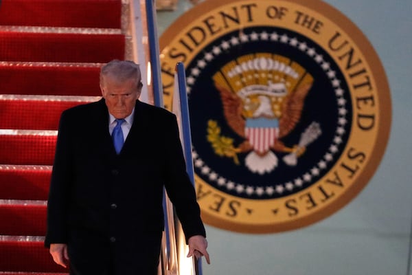 President Donald Trump walks down the stairs of Air Force One upon his arrival at Joint Base Andrews, Md., Sunday, March 9, 2025. (AP Photo/Luis M. Alvarez)