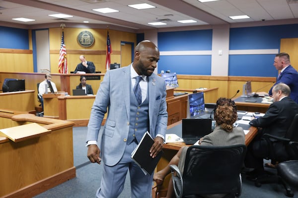 Special Prosecutor Nathan Wade, representing the District Attorney's office, returns to his seat after arguments before Fulton County Superior Judge Scott McAfee who heard motions from attorneys representing Ken Chesebro and Sidney Powell in Atlanta on Wednesday, Sept. 6, 2023.   (AP photo/Jason Getz, Pool )