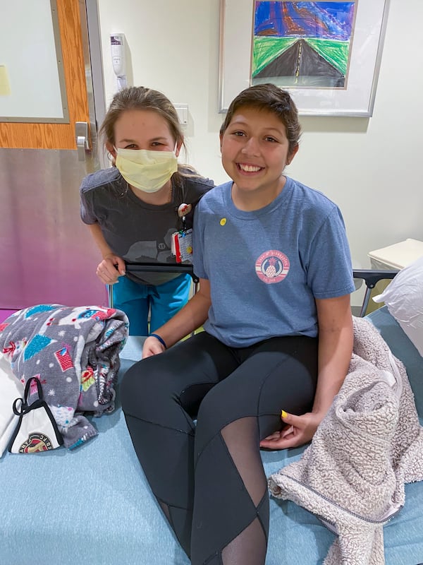 Amelia Ballard with Dani Cuevas, who is 15. Dani said Ballard has been an enormous source of support. (Courtesy of Children’s Healthcare of Atlanta)