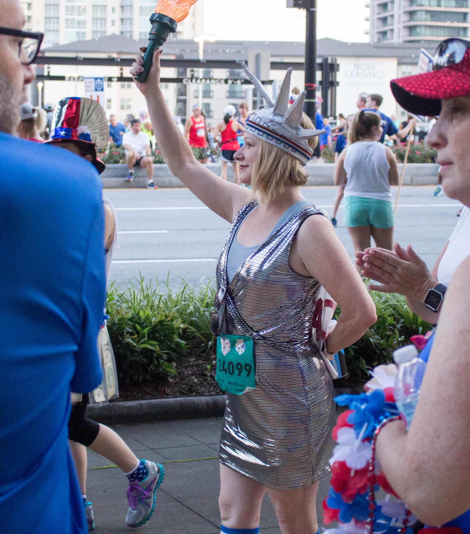 7/3/18 - Atlanta - Nancy Wall poses for a photo while dressed as the Statue of Liberty for the annual AJC Peachtree Road Race on Wednesday, July 4. She says she dressed up to celebrate the United States' birthday. She has on a cape that reads, "I care." She says it is supposed to show her support for immigrants. Jenna Eason / Jenna.Eason@coxinc.com